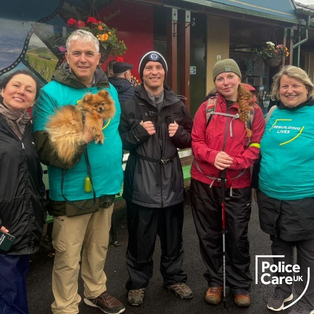 Five walkers line up to pose for a picture after completing the National Three Peaks Challenge