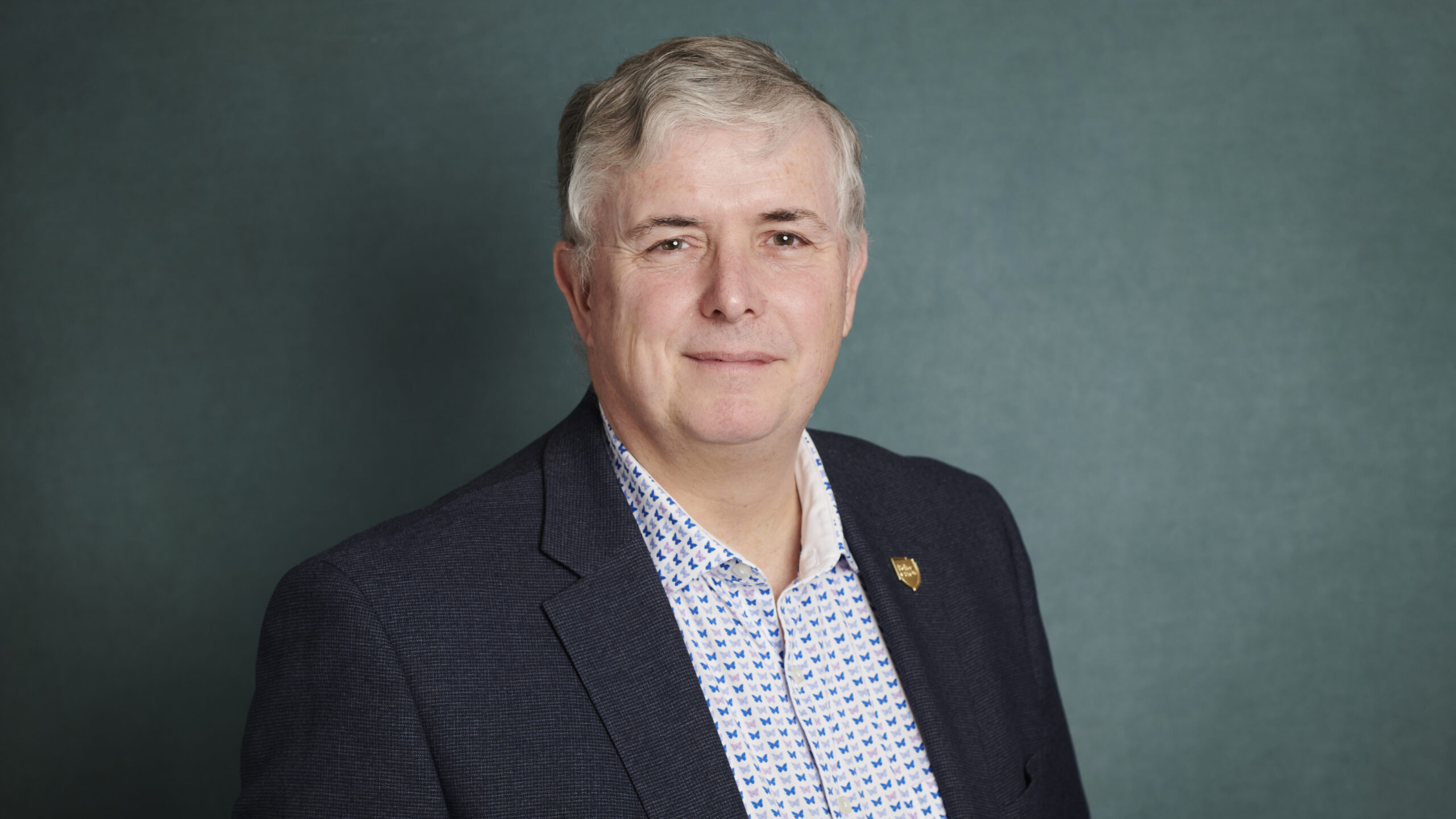 Portrait picture of Police Care UK chief executive Geoff Cheshire on a dark background